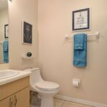 Hall bathroom nicely appointed with vacation-y artwork to keep you in that Florida-mood.

Looking South.