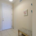 Front door is the left.  Sitting bench is conveniently located for when you walk in or are getting ready to walk out.

Looking East.