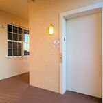 Elevator door.  Unit 303 (next to your home) is to the left.  Your home is down the hall to the right.

Looking North.