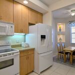 Fridge with in-door water and ice dispenser.  Morning room to the right.

Looking Northeast.