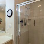 Primary bath has a walkin shower with shower nozzle on hose so you can move it around the shower.  Grab bars in the shower aid in safety.

Looking Southeast.