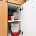 Kitchen cabinets. Storage containers.

Looking West.