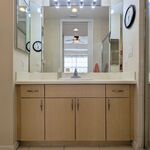 Private bath from the bedroom area.  Sink with lots of counter space.  Medicine cabinet on the left side to hold even more. 

Looking East.