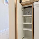 Kitchen cabinets.  Measuring cups and spare storage.

Looking West.
