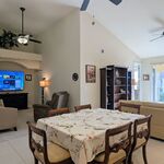 Dining Room with 75 inch Television and family room to the left, Living Room Sitting Area to the right.

Looking Southwest.