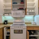 Kitchen cabinets around the Oven/Range and Microwave.  You can see that things are well stocked.

Looking North.