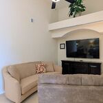 A long couch makes a great place to read a book while you relax in the family room.

Looking South.