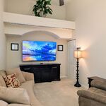 Attractive family room with 75 inch television and entertainment center.

Looking South.